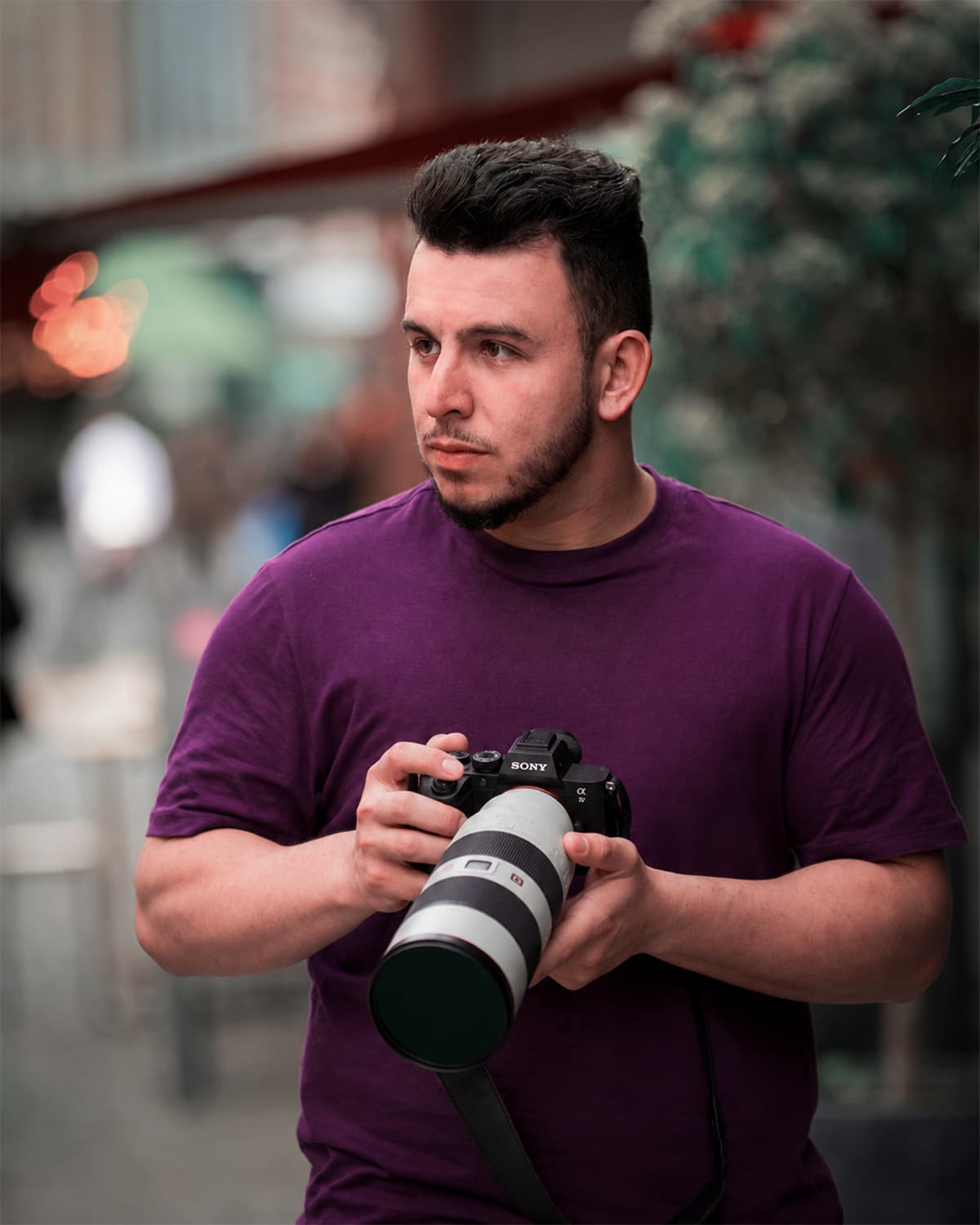 Jadson Duarte, founder of DuartFilms, on location with a camera